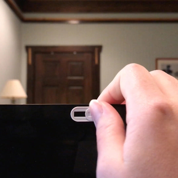 One Bad Guy Blocker Webcam Security Curtain in White with Silver Lashes by Tech Candy in use on a computer screen