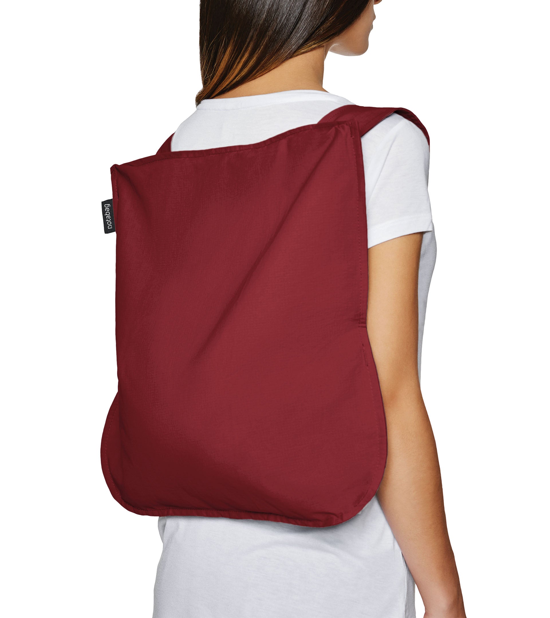 Notabag Foldable reusable backpack/tote in Wine red unfolded to backpack and on a models back